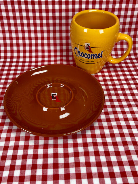 Chocomel mug next to saucer - Big Bite Dutch Treats