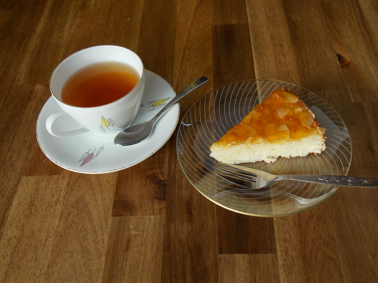 Slice of coconit tart on plate with tea - kokostaartje - Big Bite Dutch Treats